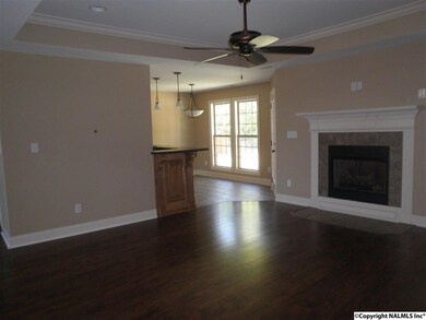 From the foyer, you will enter the great room with it's updated flooring, gas log fireplace, trey ceiling, canned lights, and ceiling fan.