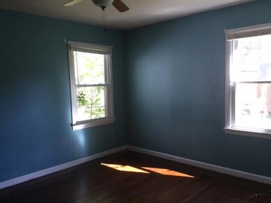 Home has two bedrooms and 1 bath.  Additional room could be used as a third.