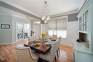 Opens to front door and next to kitchen