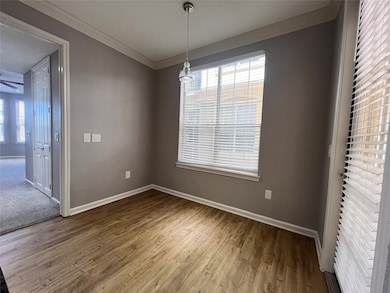 The dining area is off of the kitchen. The door go