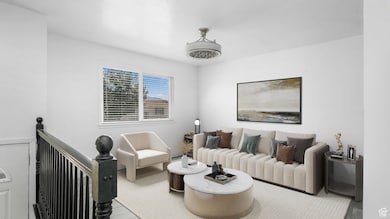 Living area featuring an upstairs landing and wood finished floors