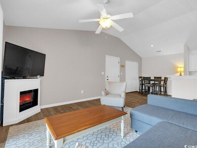 Living room with dark hardwood / wood-style floors