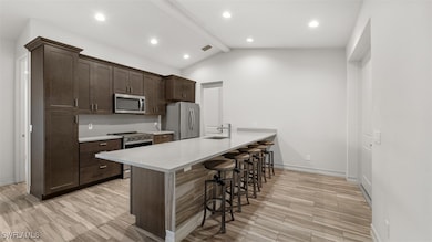 Kitchen featuring a kitchen breakfast bar, lofted