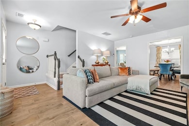 Living area with light wood finished floors, ceili