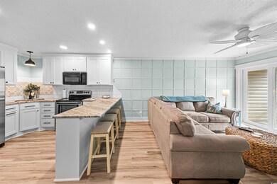 Kitchen with electric range, decorative light fixt