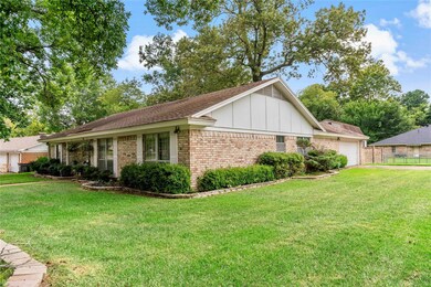 View of property exterior featuring a garage and a