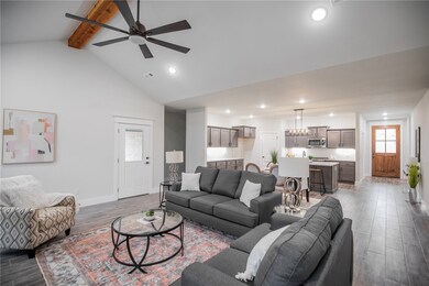 Spacious living room with cedar beam!
