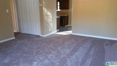 Living room showing hallway laundry closet