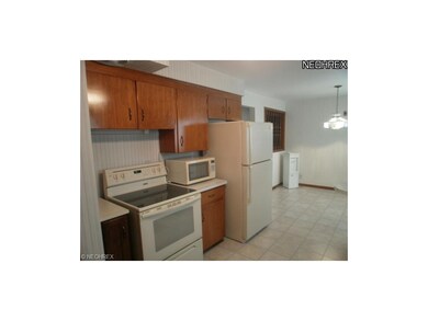 This kitchen offers Lots of cabinet space , neutra