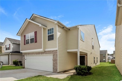 View of front of home featuring a garage, a front 