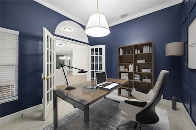 Virtually Staged. Study with crown molding and wall details.