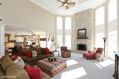 Dramatic 2 story Family Room has floor to ceiling 