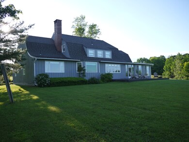back of house w/ windows to southeast