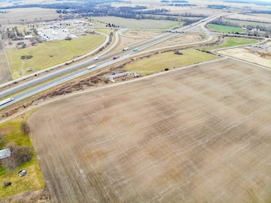 Looking northeast, shows businesses on north side of interstate at exit.