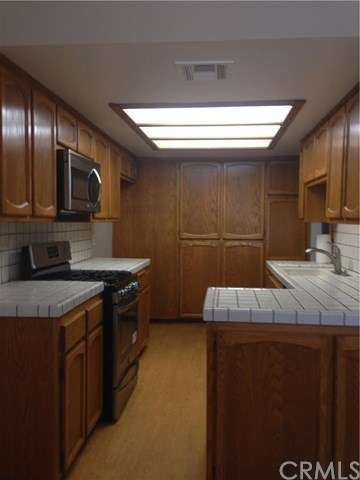 Kitchen has new stainless appliances.
