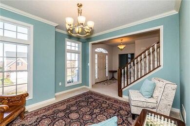 Welcoming foyer and front sitting room.