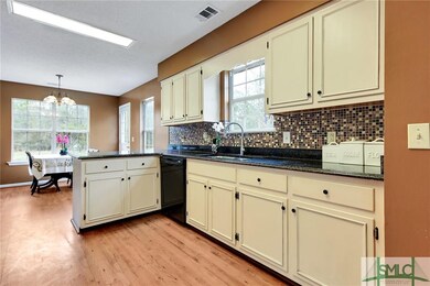 Granite Countertops and Tile Backsplash in Kitchen