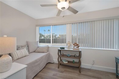 Sitting room featuring vaulted ceiling, ceiling fa