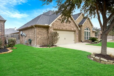 This home has beautiful curb appeal with a long double-wide driveway 5 foot garage extension.