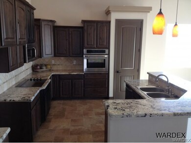 Knotty Alder CabinetryGranite