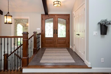 Front Foyer with steps leading to Lower Level