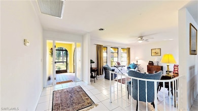 The large front foyer leads to the sunken living area and Great room.