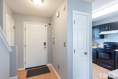 Entry foyer with coat closet and laminate floors l