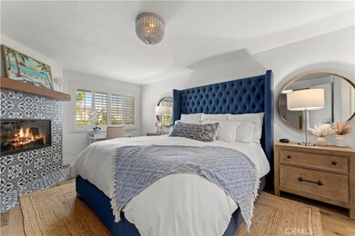 Primary suite with luxury vinyl flooring, upgraded fireplace, plantation shutters...