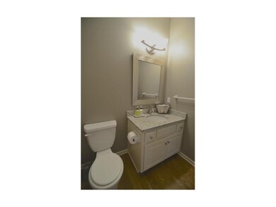 First floor half bathroom features granite counter