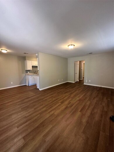Unfurnished living room with baseboards, visible 