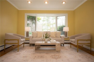 Bow window, hardwood floors, crown moldings
