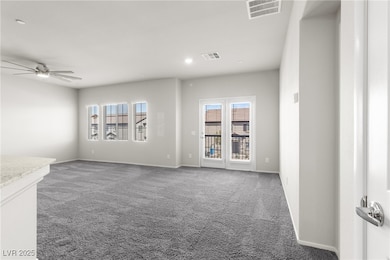 Unfurnished living room featuring carpet, recessed lighting, and a ceiling fan
