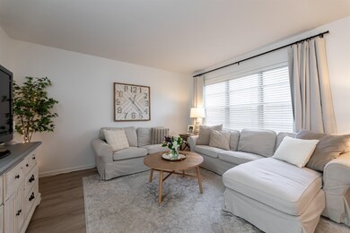 Living room featuring light hardwood / wood-style 