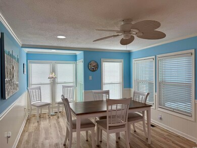 Dining space with ceiling fan, light hardwood / wo