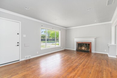 Unfurnished living room with hardwood / wood-style