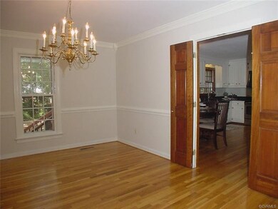 Dining room has bi-swing paneled doors to kitchen