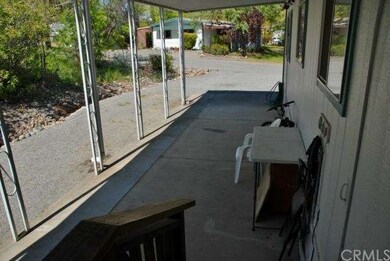 Covered rear door porch and side.