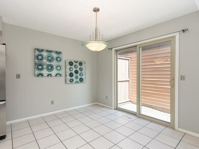 Informal dining between kitchen and patio.