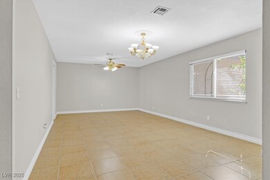 Unfurnished room featuring baseboards, visible ven