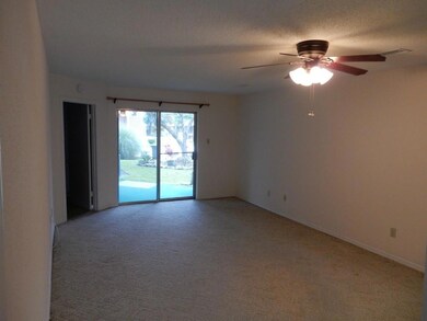 Spacious Den with View of Pool Area and Meticulous