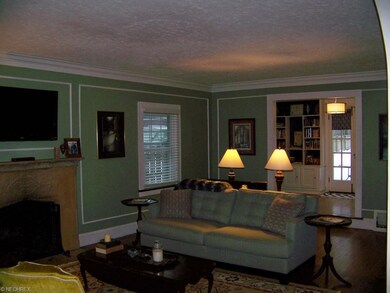 Formal Living Room with Sandstone Fireplace and Ha
