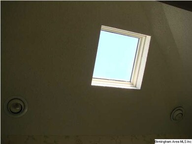 Master bath has a skylight and recessed lighting w