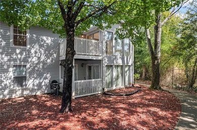 View of side of home featuring a deck