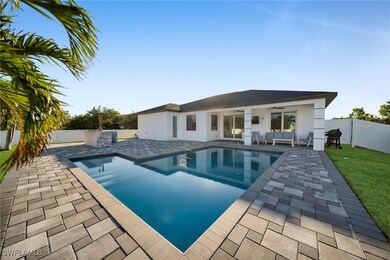 View of swimming pool featuring a patio, an outdoo