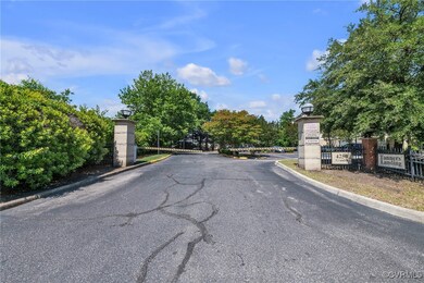 View of asphalt street with curbs, street lights,