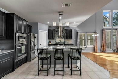 Open kitchen with higher end granite countertops, 