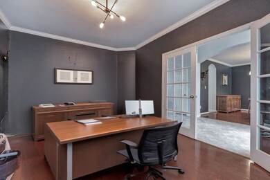 This photo showcases a stylish home office with da