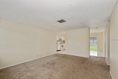 Living Rm opens left to Kitchen and right to Dinin