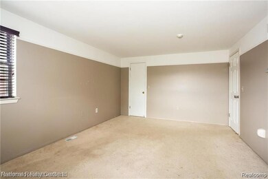 Unfurnished room with carpet floors