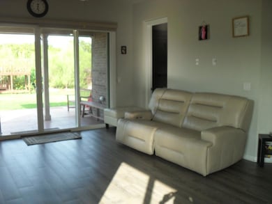 Living area featuring dark wood-type flooring